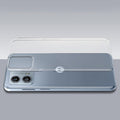 Transparent hard back case being installed on Motorola Moto G53 5G showing perfect alignment and camera protection fit