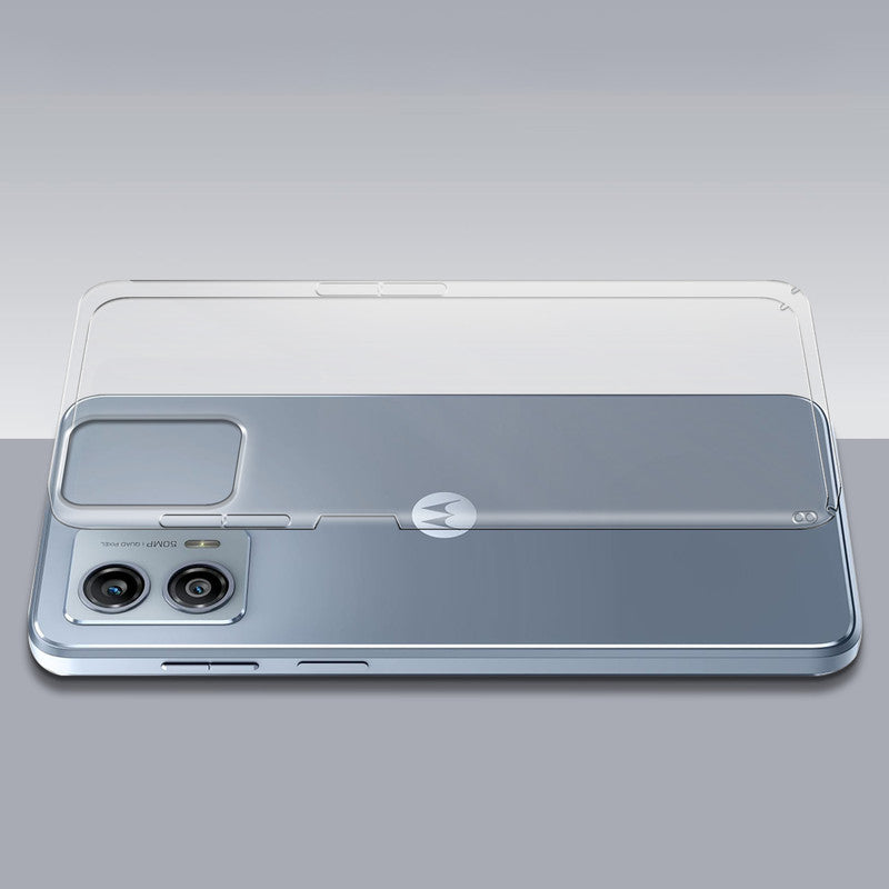 Transparent hard back case being installed on Motorola Moto G53 5G showing perfect alignment and camera protection fit