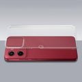 Transparent hard back case being installed on Motorola Moto G05 showing perfect alignment and camera protection fit