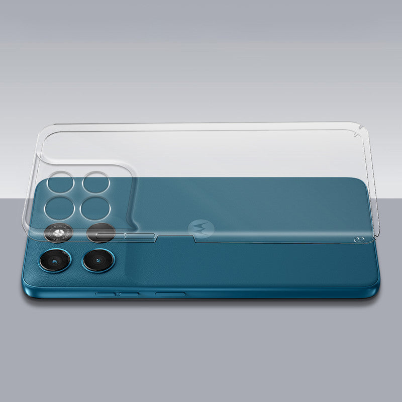 Transparent hard back case being installed on Motorola G67 Power 5G showing perfect alignment and camera protection fit