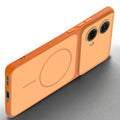Slim silicone Orange phone case for Motorola Moto G85 5G side angle view showing grip texture and precise cutouts