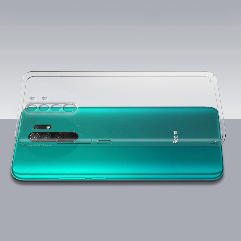 Transparent hard back case being installed on Redmi 9 Prime showing perfect alignment and camera protection fit